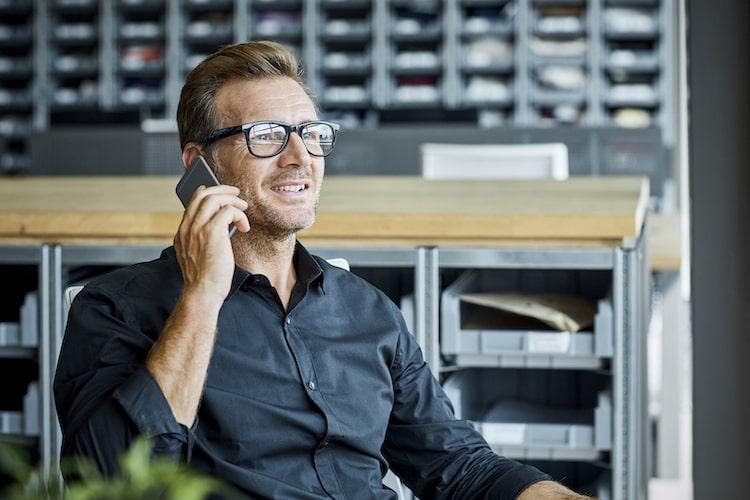 SIP Trunking - Man taking a call in a back office