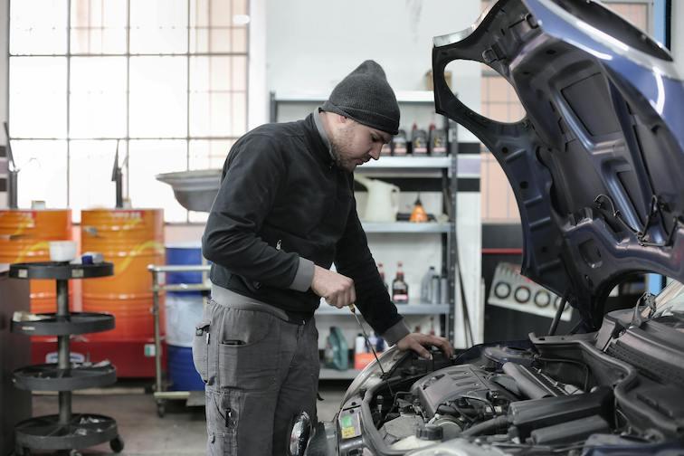 Small business internet - Man working on car in a repair shop