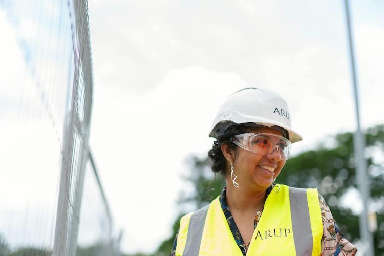 Business Continuity - Woman wearing a hardhat fixing a power outage